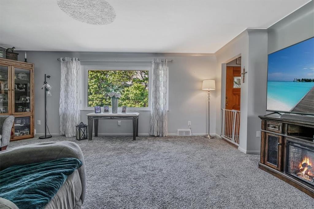 360 Jo Ann Drive Monessen, PA 15062 - Photo 6 of 48 a view of a livingroom with furniture and staircase