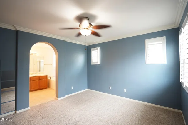 a bathroom with a tub a sink a mirror and a shower