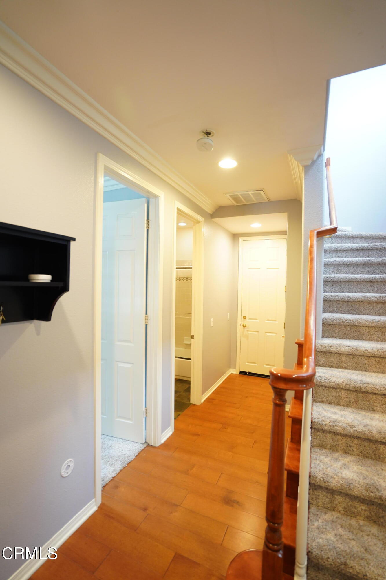 341 Spring Park Road Camarillo, CA 93012 - Photo 26 of 43 a view of a bedroom with wooden floor and stairs