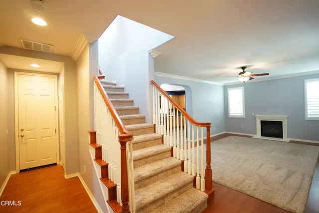 a view of an empty room with window and closet area