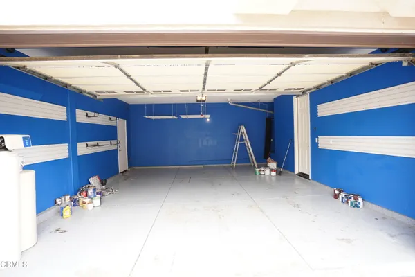 a view of a house with a tree in the background
