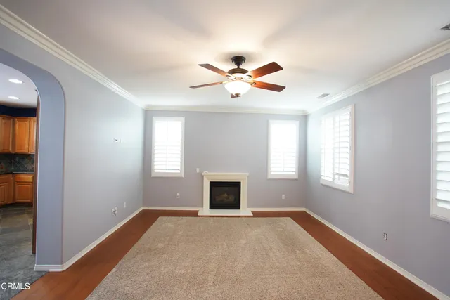 a large kitchen with kitchen island granite countertop a large window and a sink