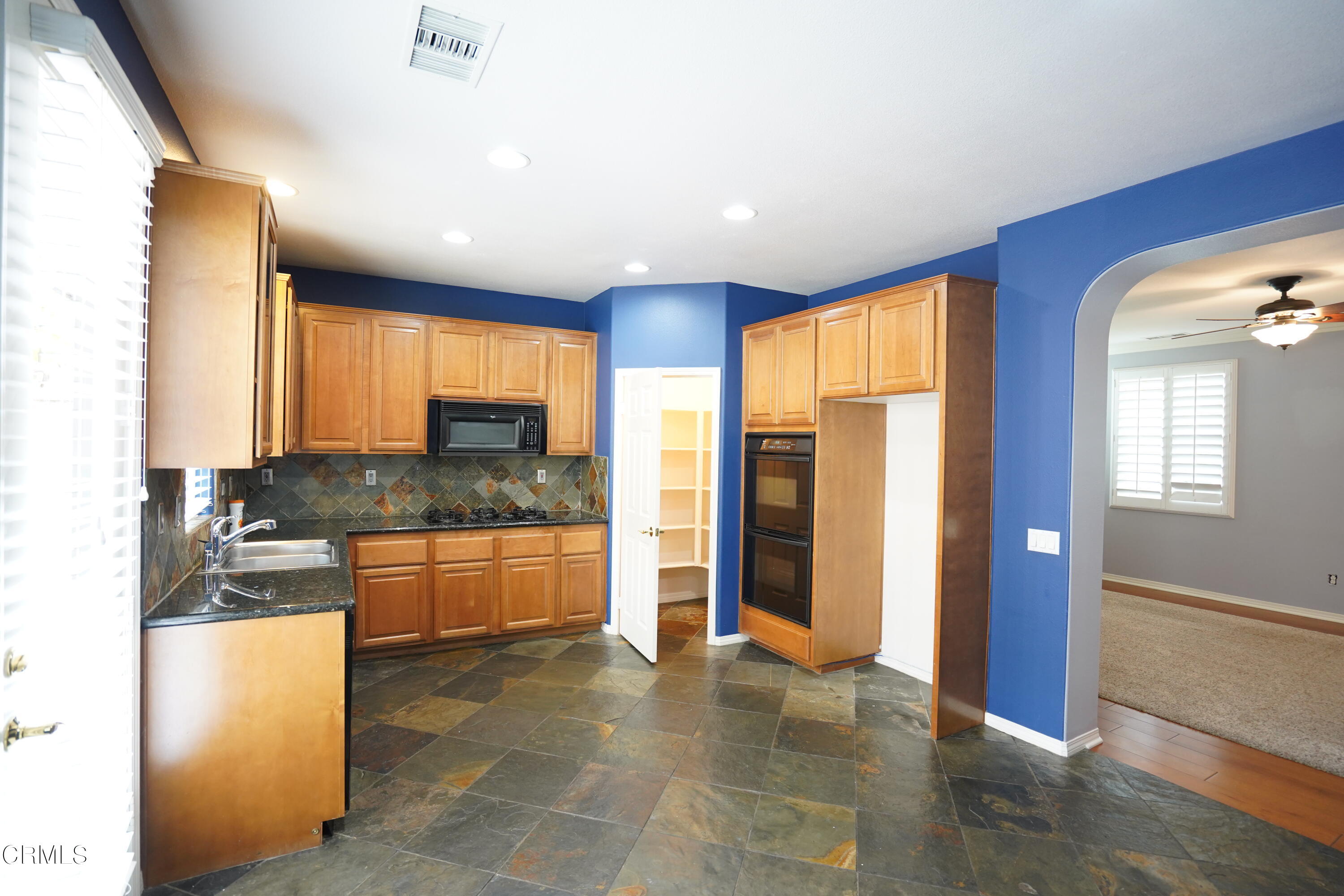 341 Spring Park Road Camarillo, CA 93012 - Photo 9 of 43 a large kitchen with stainless steel appliances granite countertop a refrigerator and a stove top oven