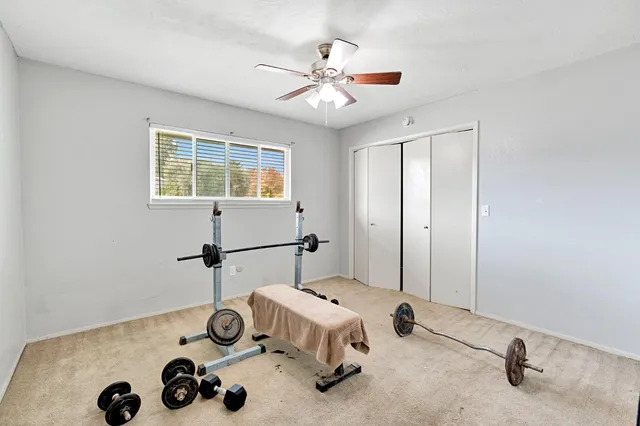 a workspace with chandelier fan