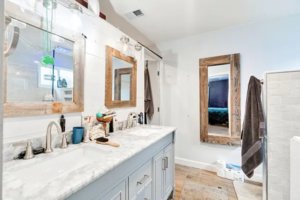 a bathroom with a sink and a mirror
