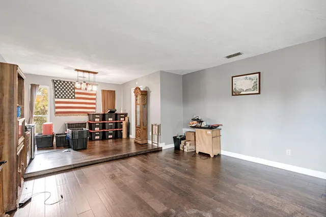 a room with furniture and wooden floor