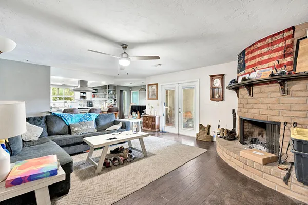 a living room with furniture and a fireplace