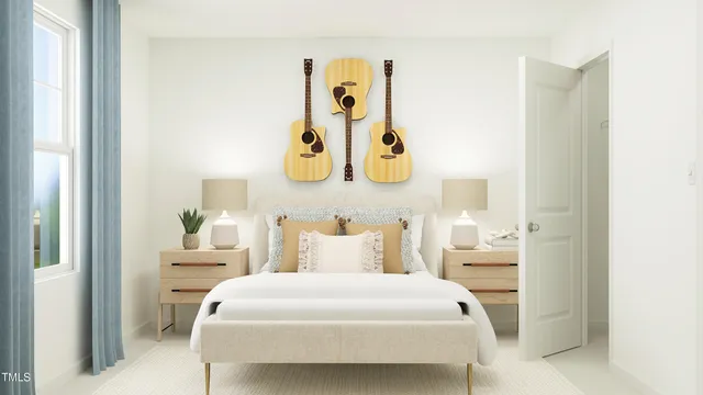 a bedroom with a bed and painting on the wall