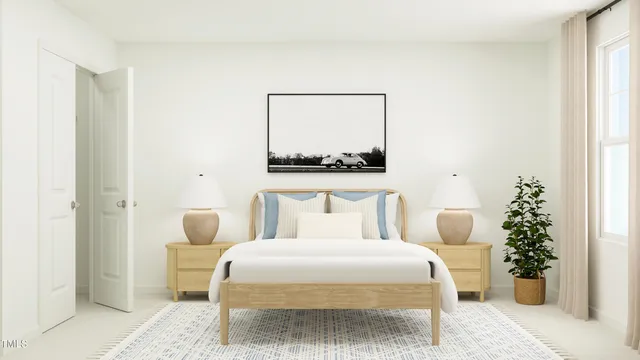 a bedroom with a bed and a painting on the wall