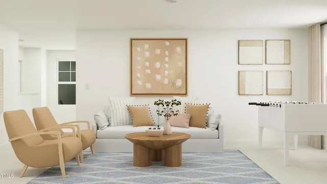a living room with furniture and a painting