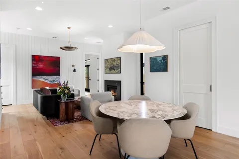 a kitchen with a table and chairs in it