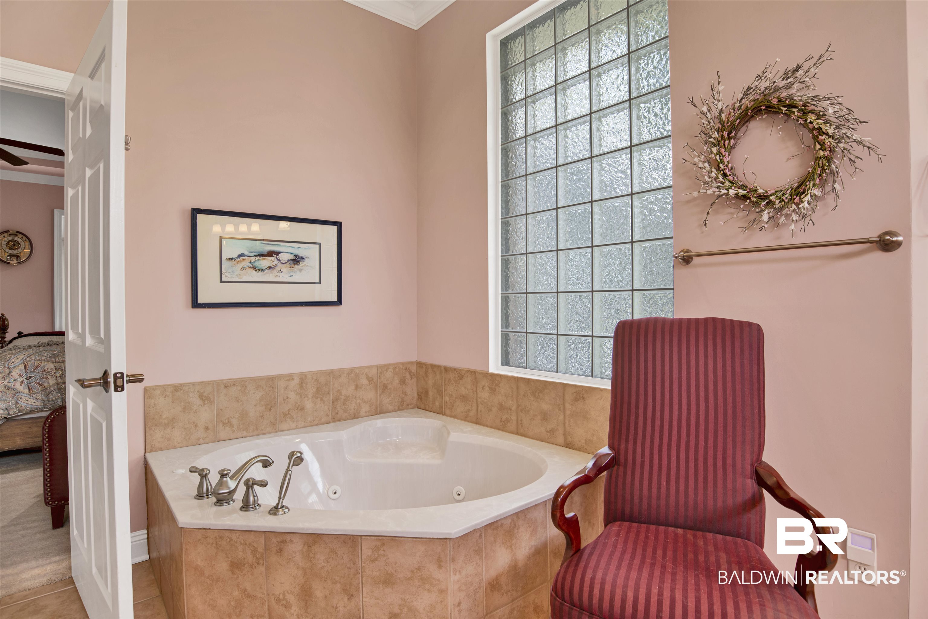 23014 Carnoustie Drive Foley, AL 36535 - Photo 10 of 49 Ensuite bathroom with a tub with jets and ornamental molding