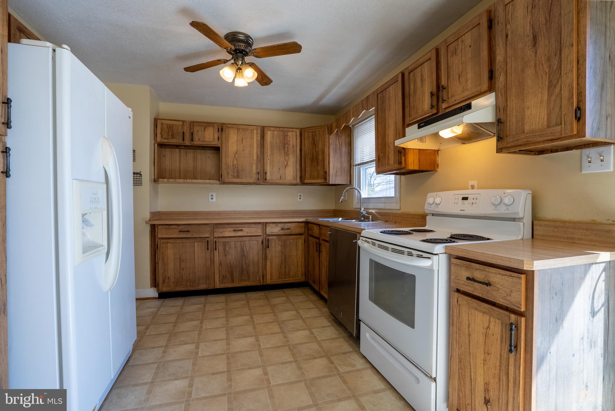 2275 Dairy Farm Road Gambrills, MD 21054 - Photo 11 of 57 a kitchen with a stove sink and cabinets