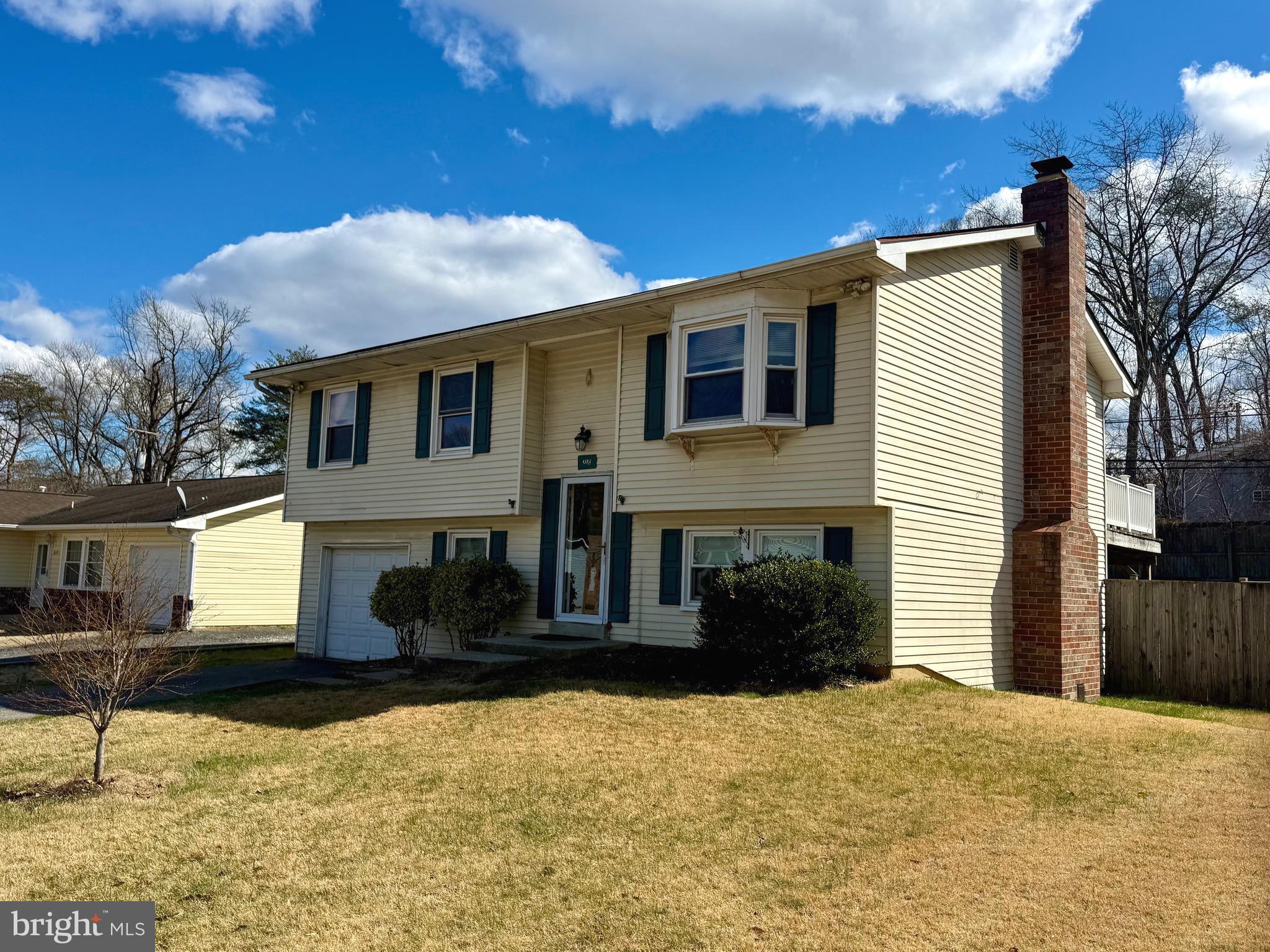 2275 Dairy Farm Road Gambrills, MD 21054 - Photo 2 of 57 a front view of a house with a yard