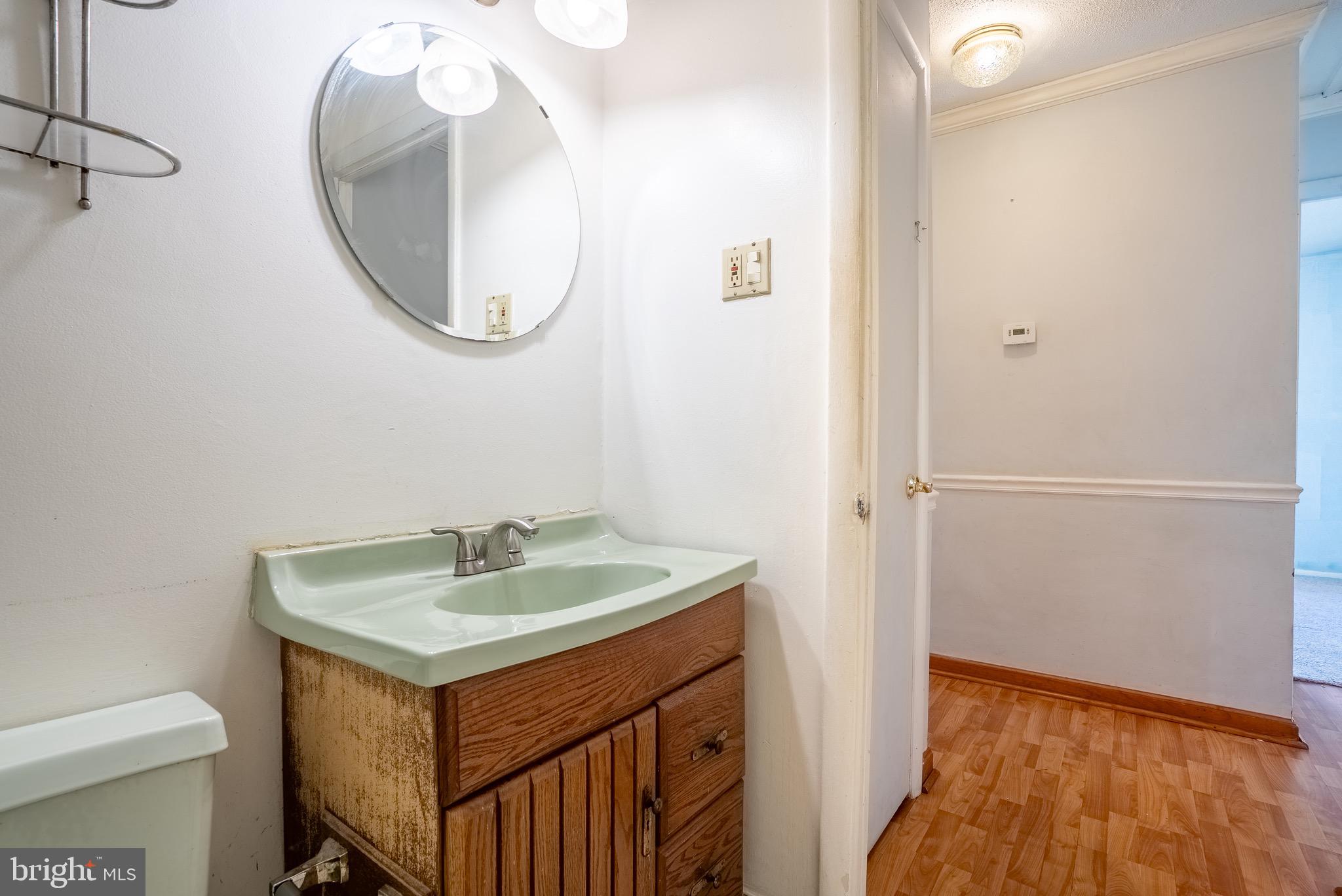 2275 Dairy Farm Road Gambrills, MD 21054 - Photo 23 of 57 a bathroom with a sink and a mirror