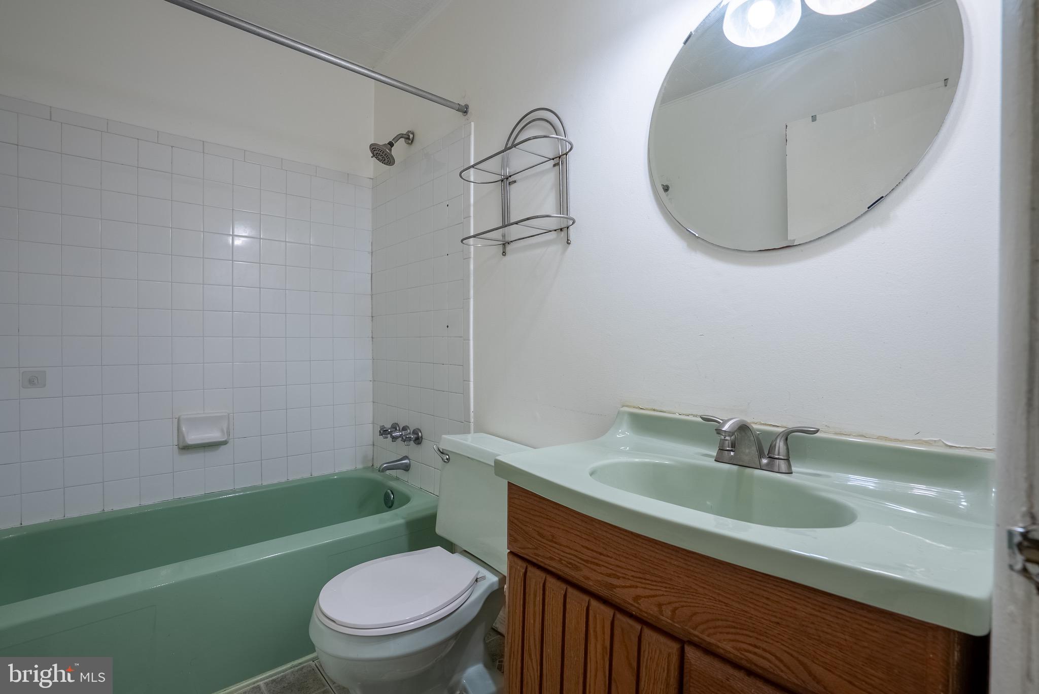 2275 Dairy Farm Road Gambrills, MD 21054 - Photo 24 of 57 a bathroom with a sink a toilet and a mirror
