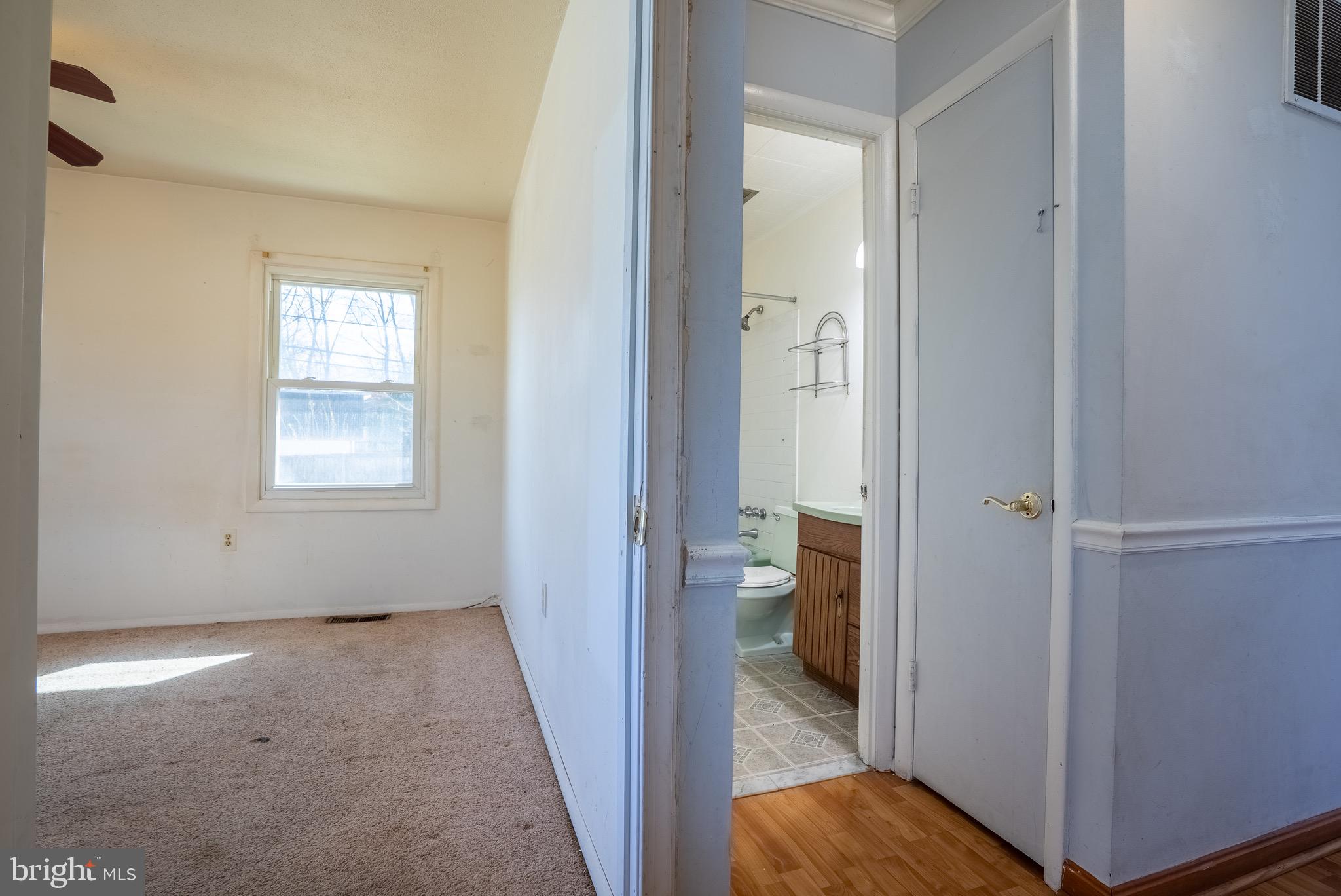 2275 Dairy Farm Road Gambrills, MD 21054 - Photo 25 of 57 a view of a hallway with a room and a livingroom with a bathroom