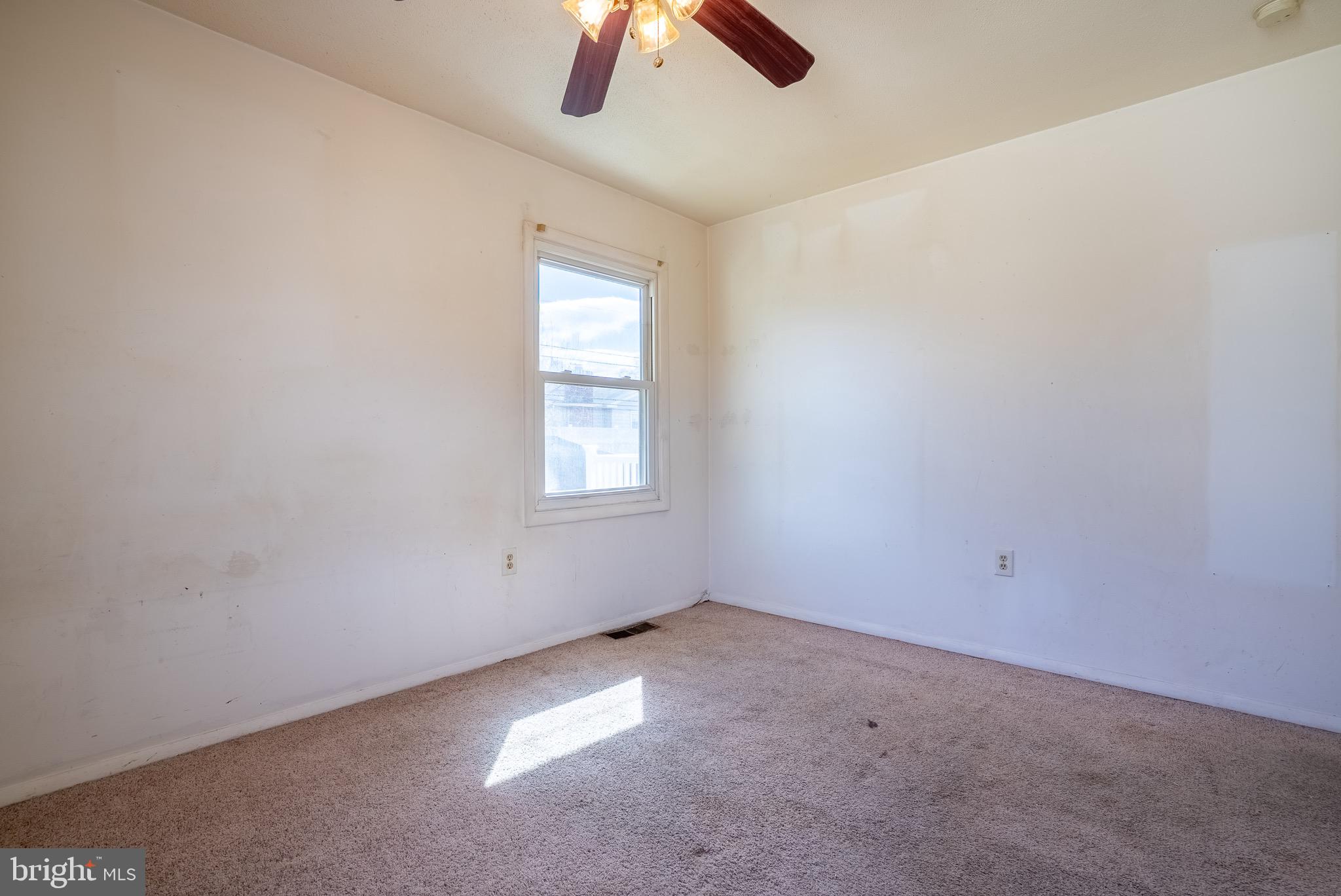 2275 Dairy Farm Road Gambrills, MD 21054 - Photo 28 of 57 an empty room with a window and a fan