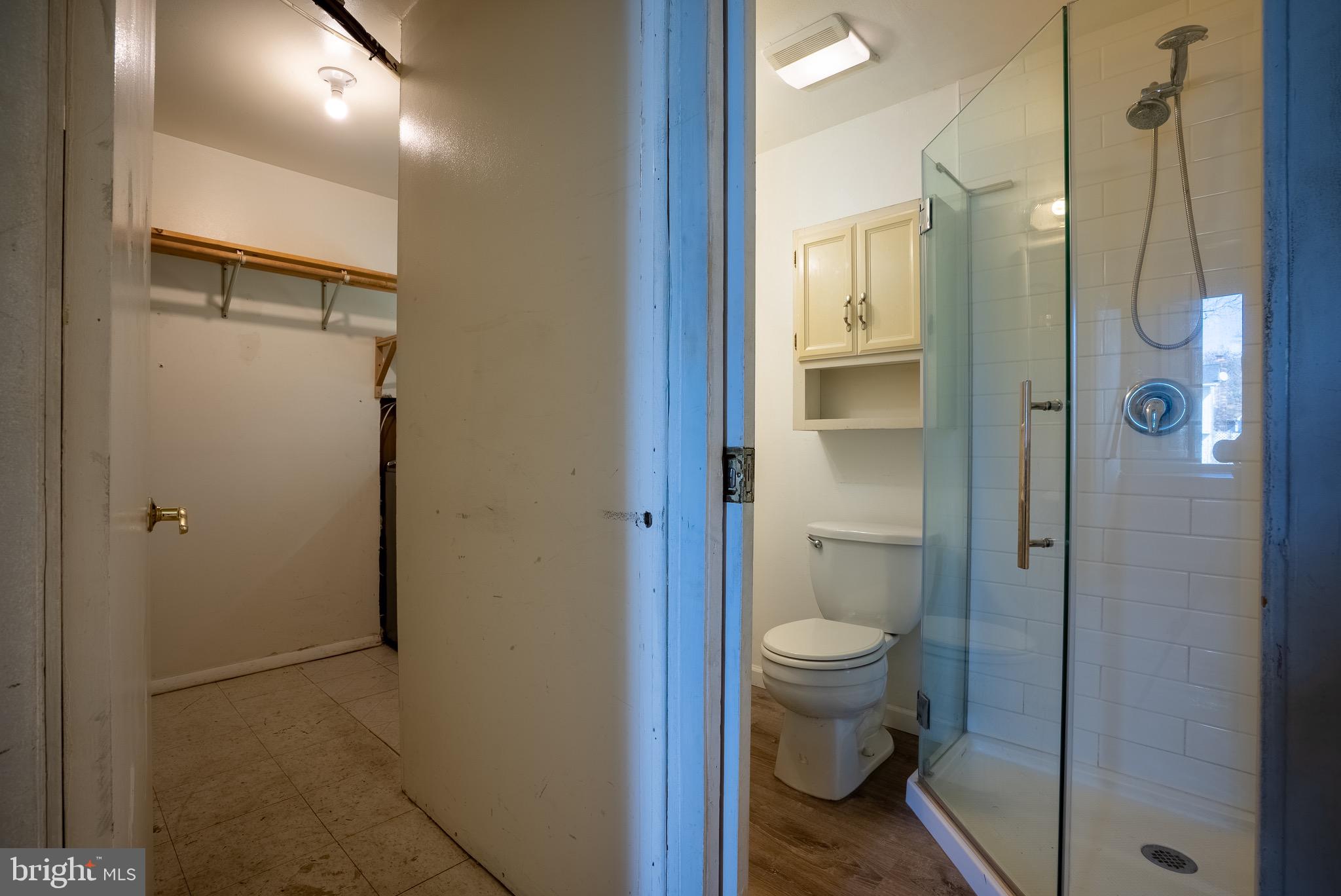 2275 Dairy Farm Road Gambrills, MD 21054 - Photo 35 of 57 a bathroom with a granite countertop toilet sink and shower