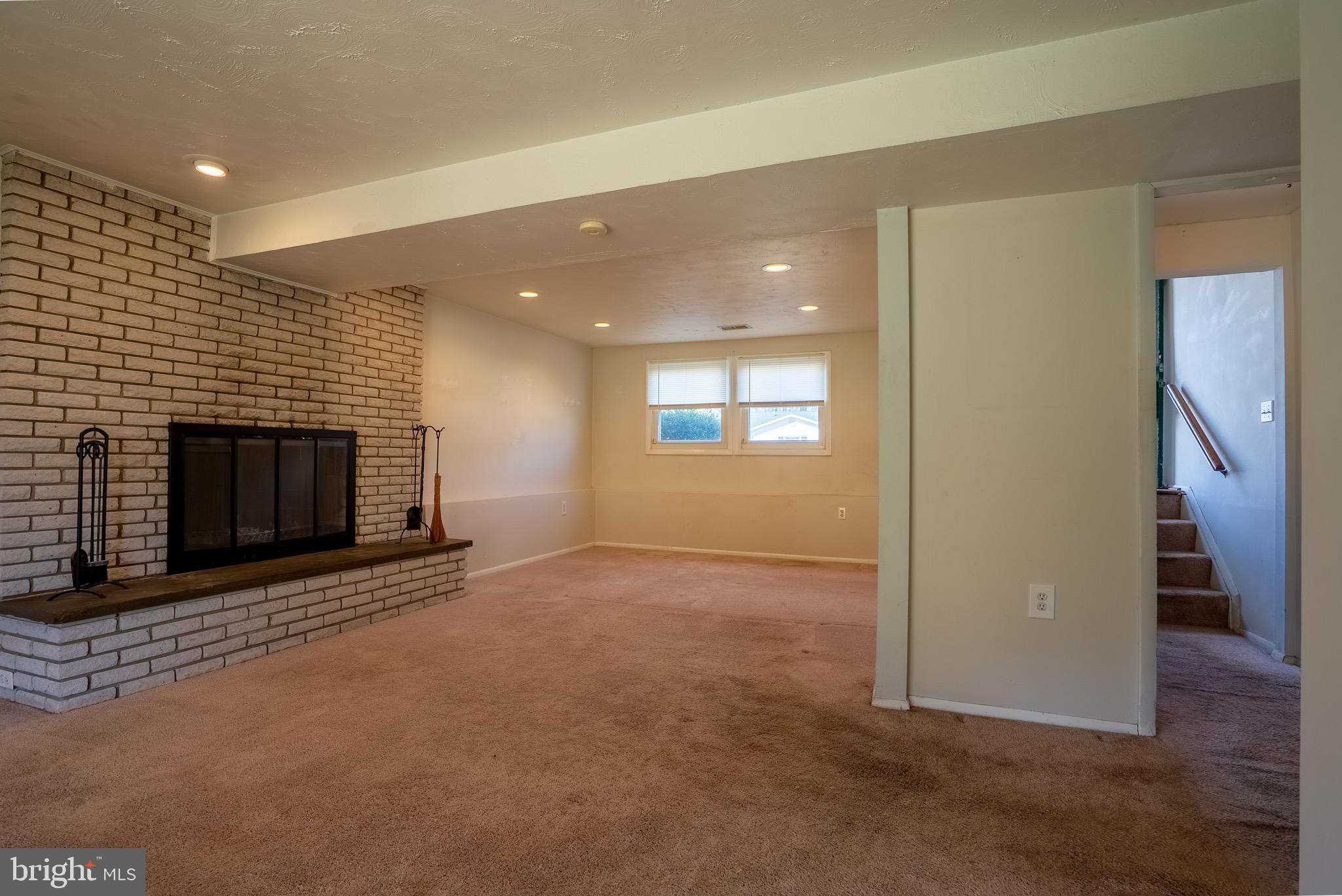 2275 Dairy Farm Road Gambrills, MD 21054 - Photo 42 of 57 an empty room with fireplace and windows