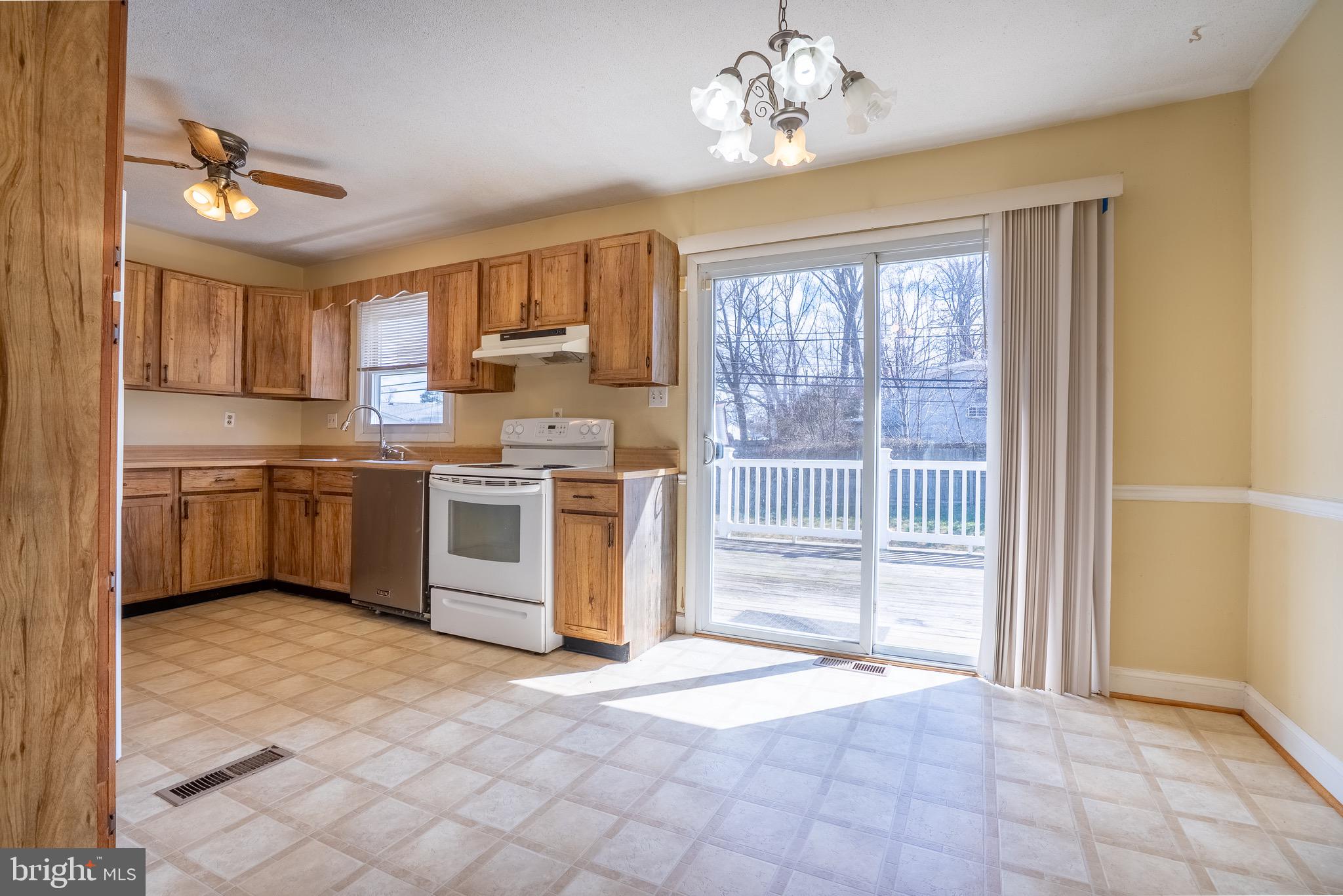2275 Dairy Farm Road Gambrills, MD 21054 - Photo 7 of 57 a kitchen with a stove a sink and a refrigerator