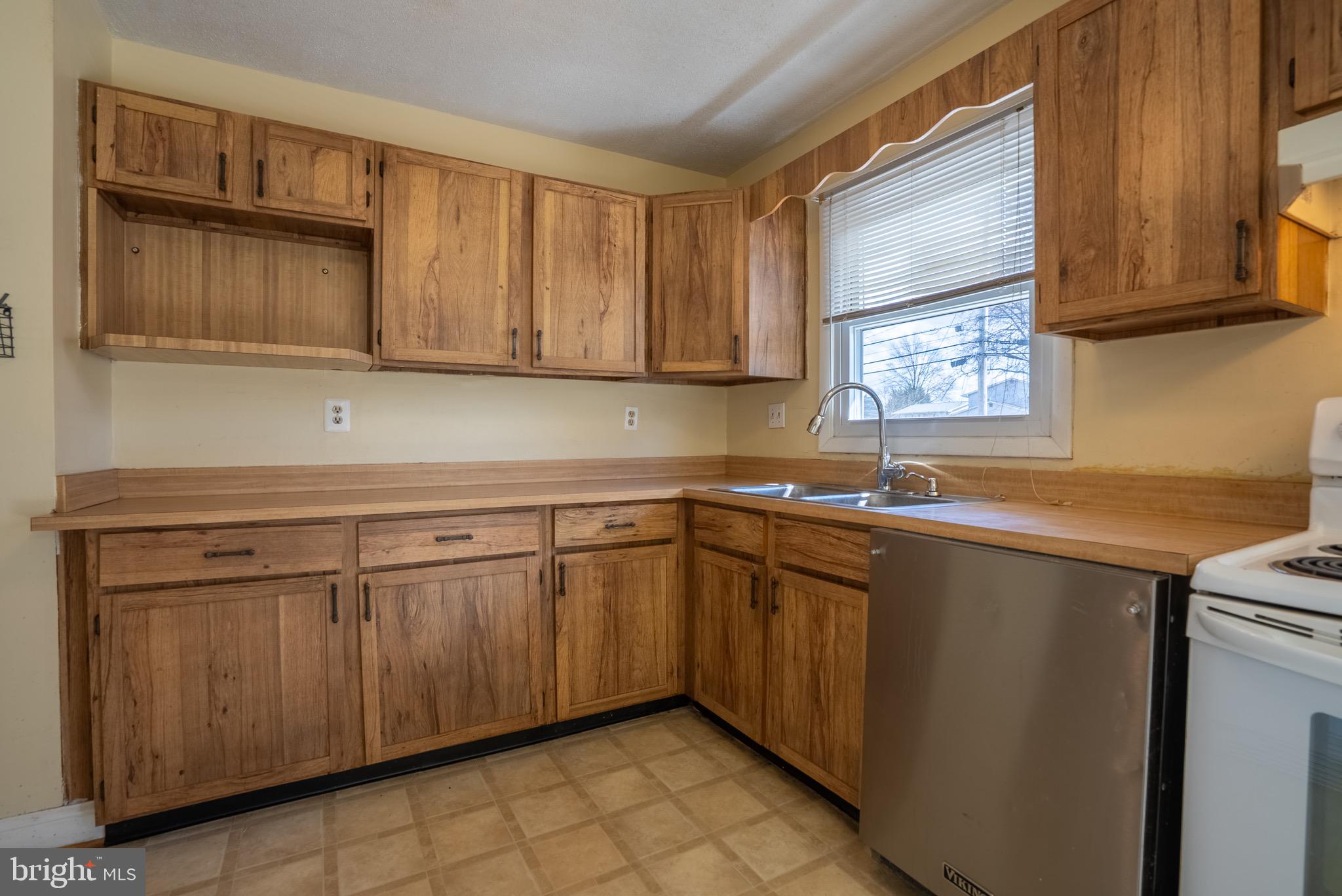 2275 Dairy Farm Road Gambrills, MD 21054 - Photo 10 of 57 a kitchen with a sink cabinets and utility