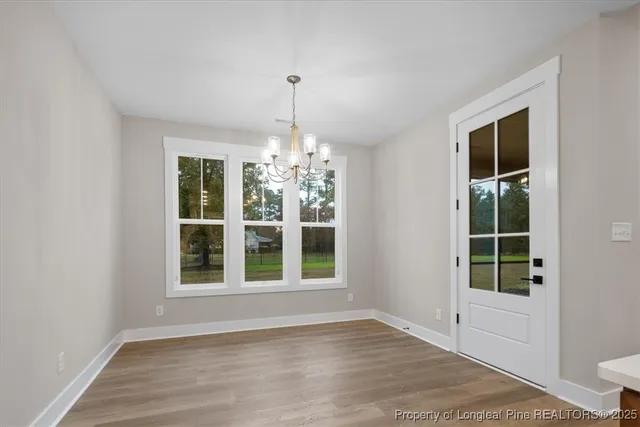 a bathroom with a double vanity sink a toilet a mirror and shower