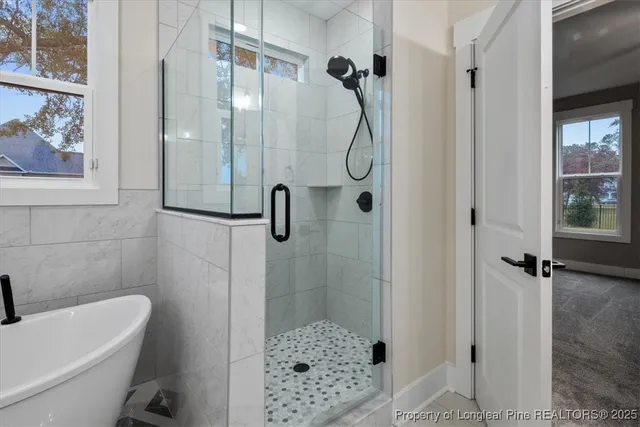 a front view of house with yard and trees around