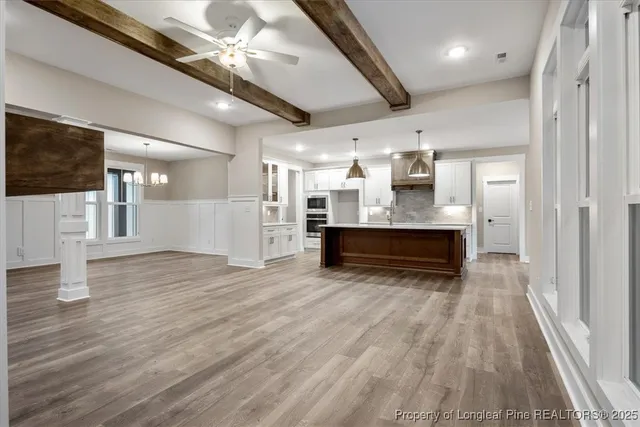 a kitchen with stainless steel appliances a stove and a refrigerator