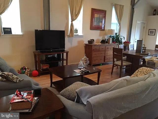 85 Valley Road, Unit 1 Phoenixville, PA 19460 - Photo 14 of 28 a living room with furniture and a flat screen tv
