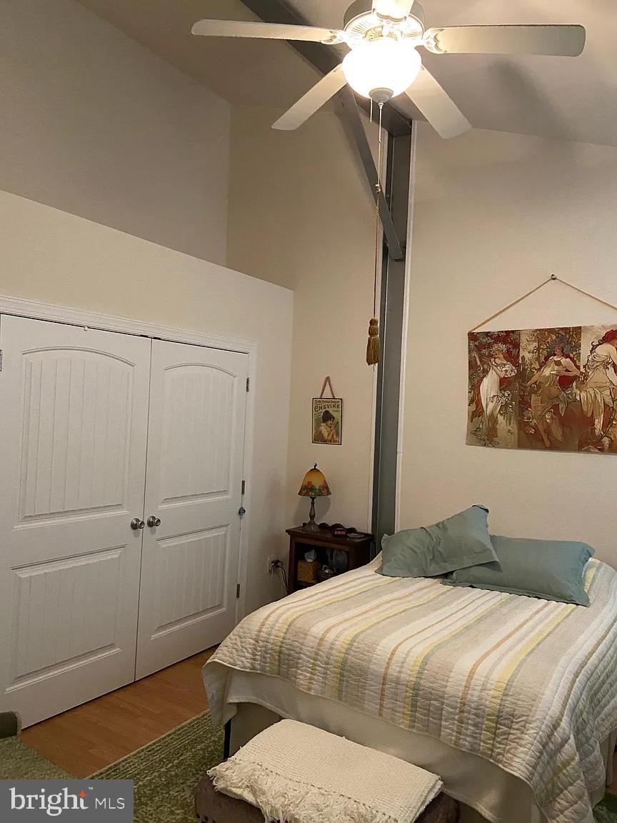 85 Valley Road, Unit 1 Phoenixville, PA 19460 - Photo 18 of 28 a bedroom with a bed and a chandelier