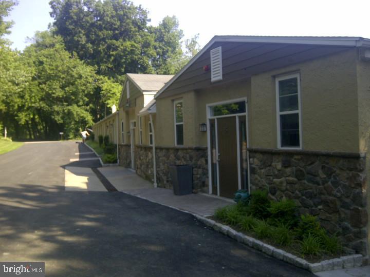 85 Valley Road, Unit 1 Phoenixville, PA 19460 - Photo 2 of 28 a view of a house with backyard and trees