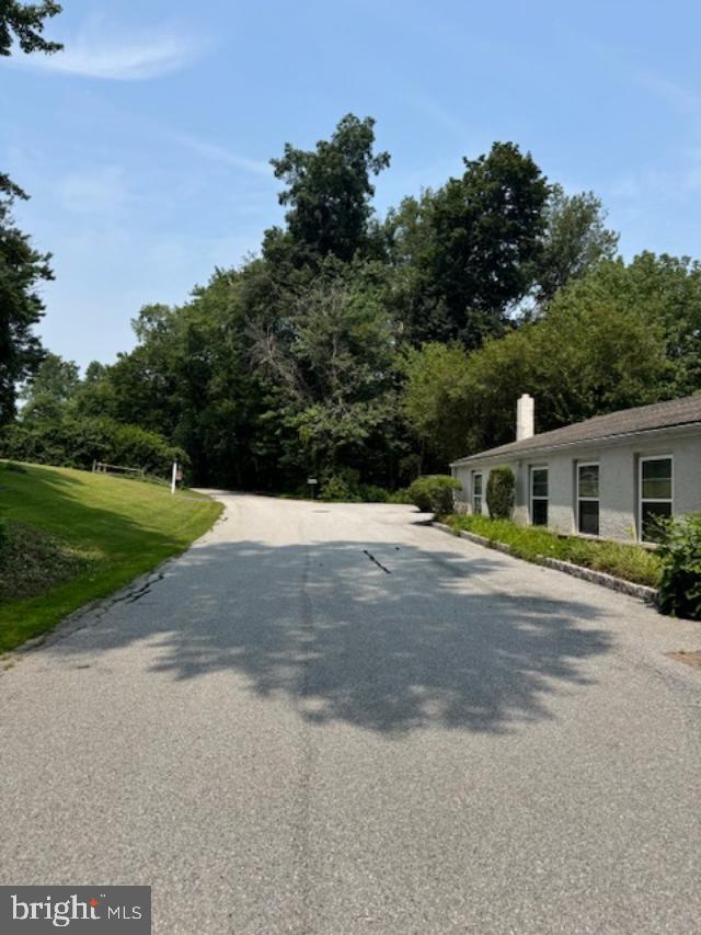 85 Valley Road, Unit 1 Phoenixville, PA 19460 - Photo 24 of 28 a front view of a house with a yard and trees