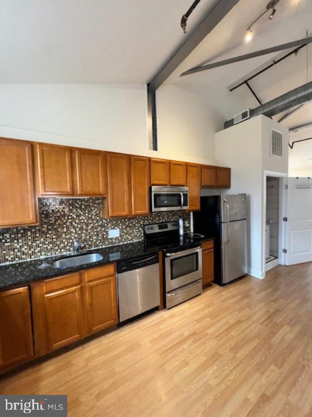 85 Valley Road, Unit 1 Phoenixville, PA 19460 - Photo 5 of 28 a kitchen with stainless steel appliances granite countertop a refrigerator and stove