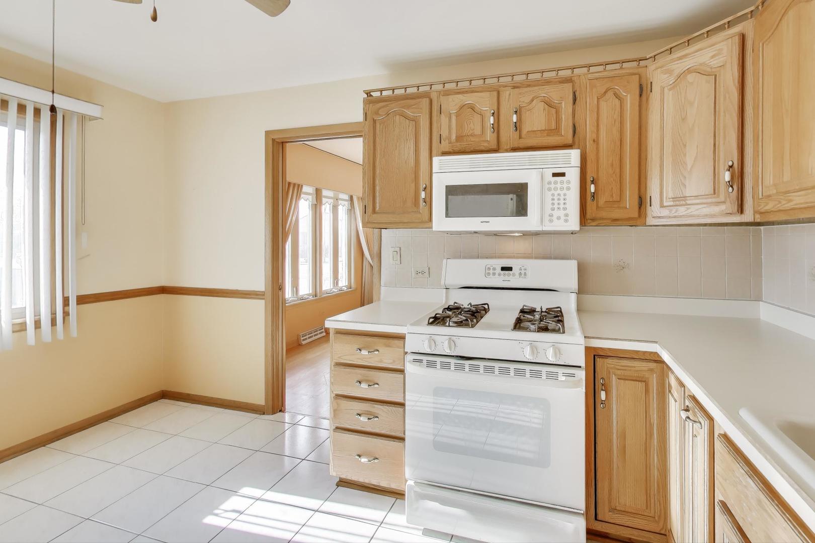 Undisclosed Address Chicago, IL 60656 - Photo 11 of 37 a kitchen with a cabinets and window