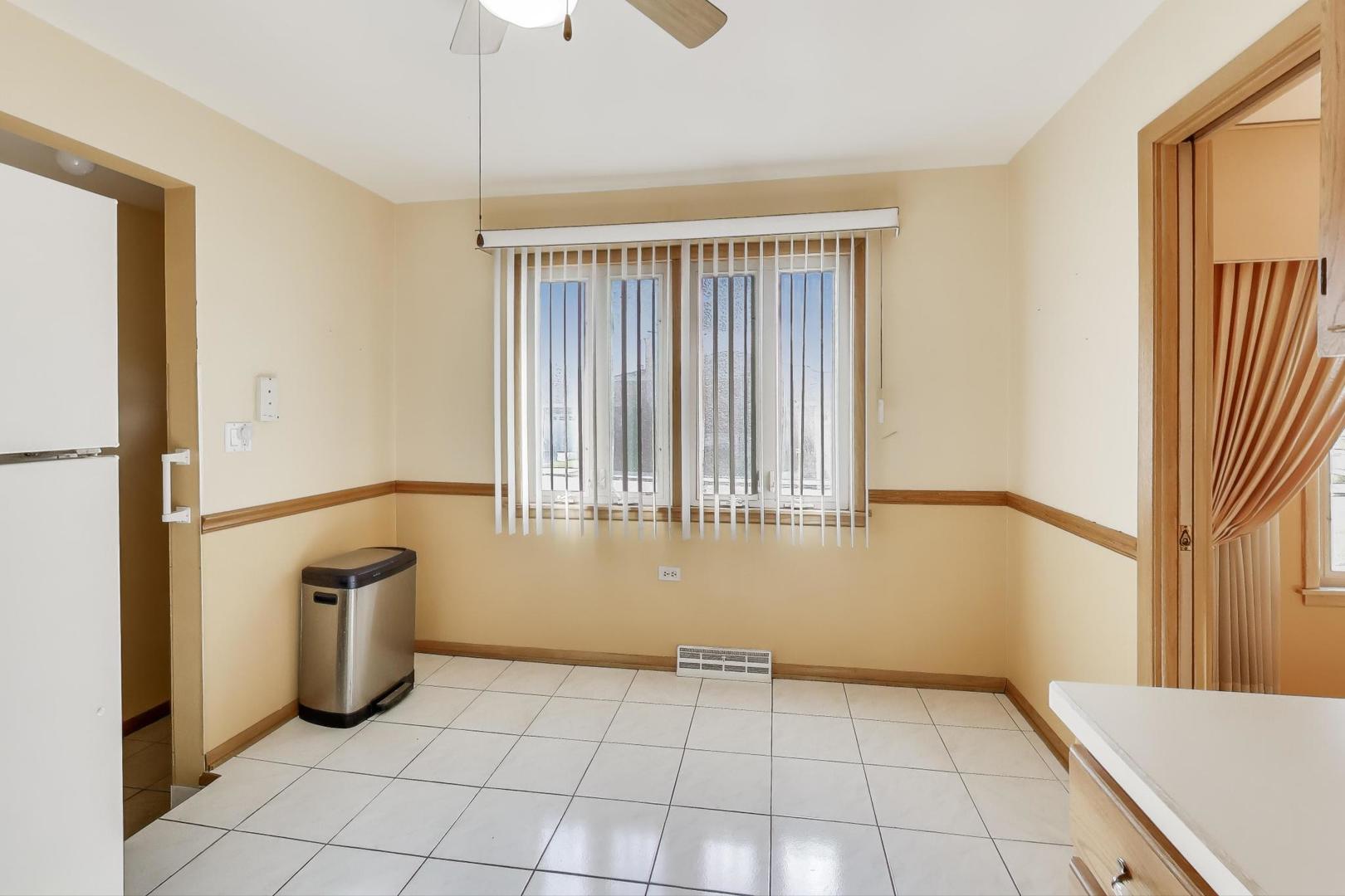 Undisclosed Address Chicago, IL 60656 - Photo 12 of 37 a view of an empty room with a window