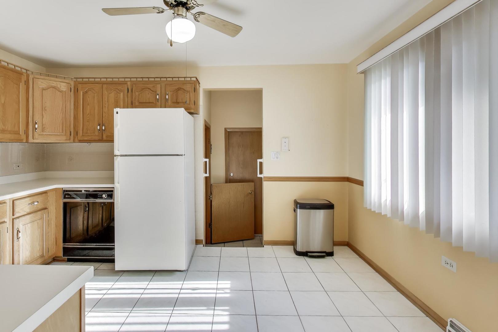 Undisclosed Address Chicago, IL 60656 - Photo 13 of 37 a kitchen with a refrigerator sink and cabinets