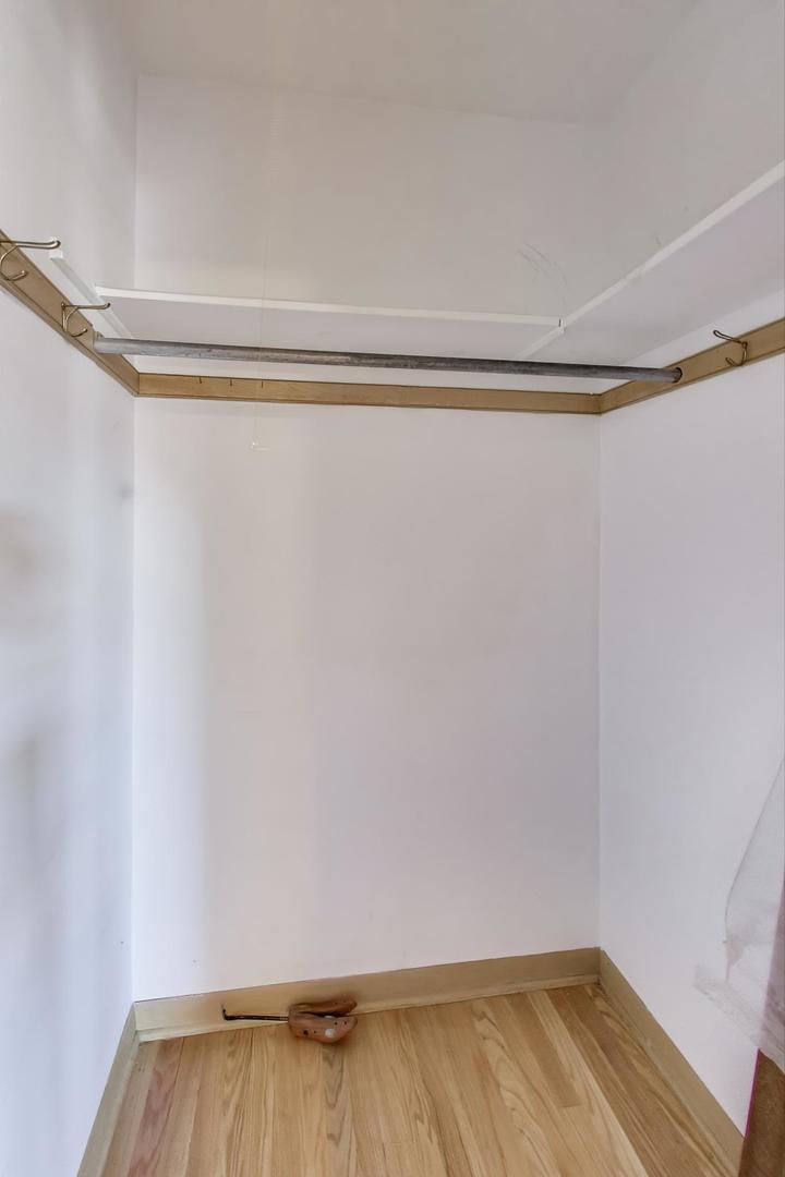 Undisclosed Address Chicago, IL 60656 - Photo 18 of 37 a view of a room with wooden floor and a window