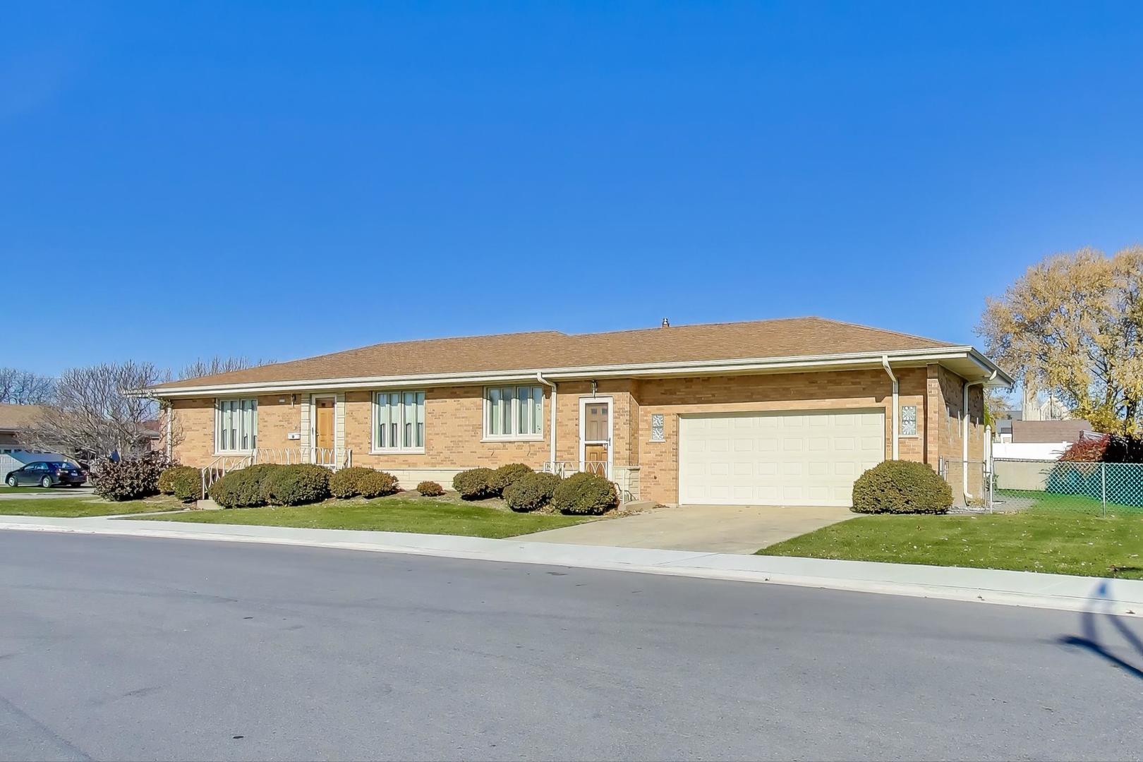 Undisclosed Address Chicago, IL 60656 - Photo 2 of 37 a front view of house with yard and green space