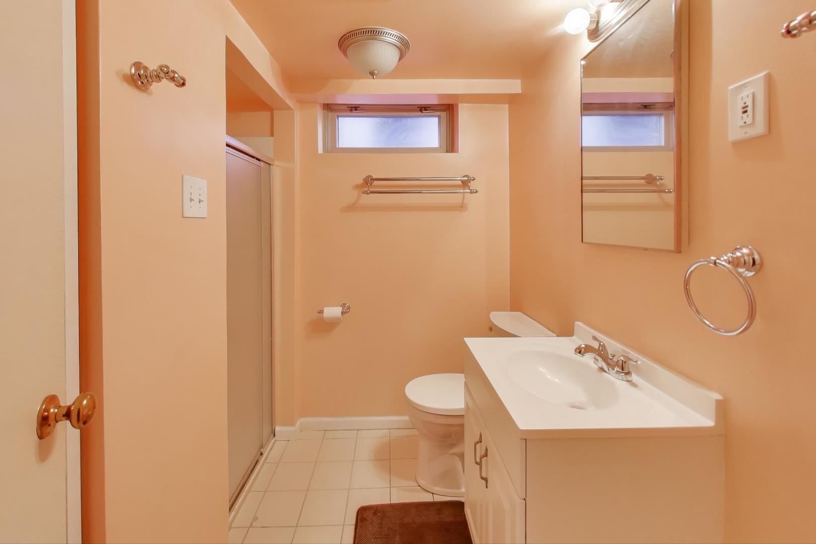 Undisclosed Address Chicago, IL 60656 - Photo 30 of 37 a bathroom with a sink a toilet and shower