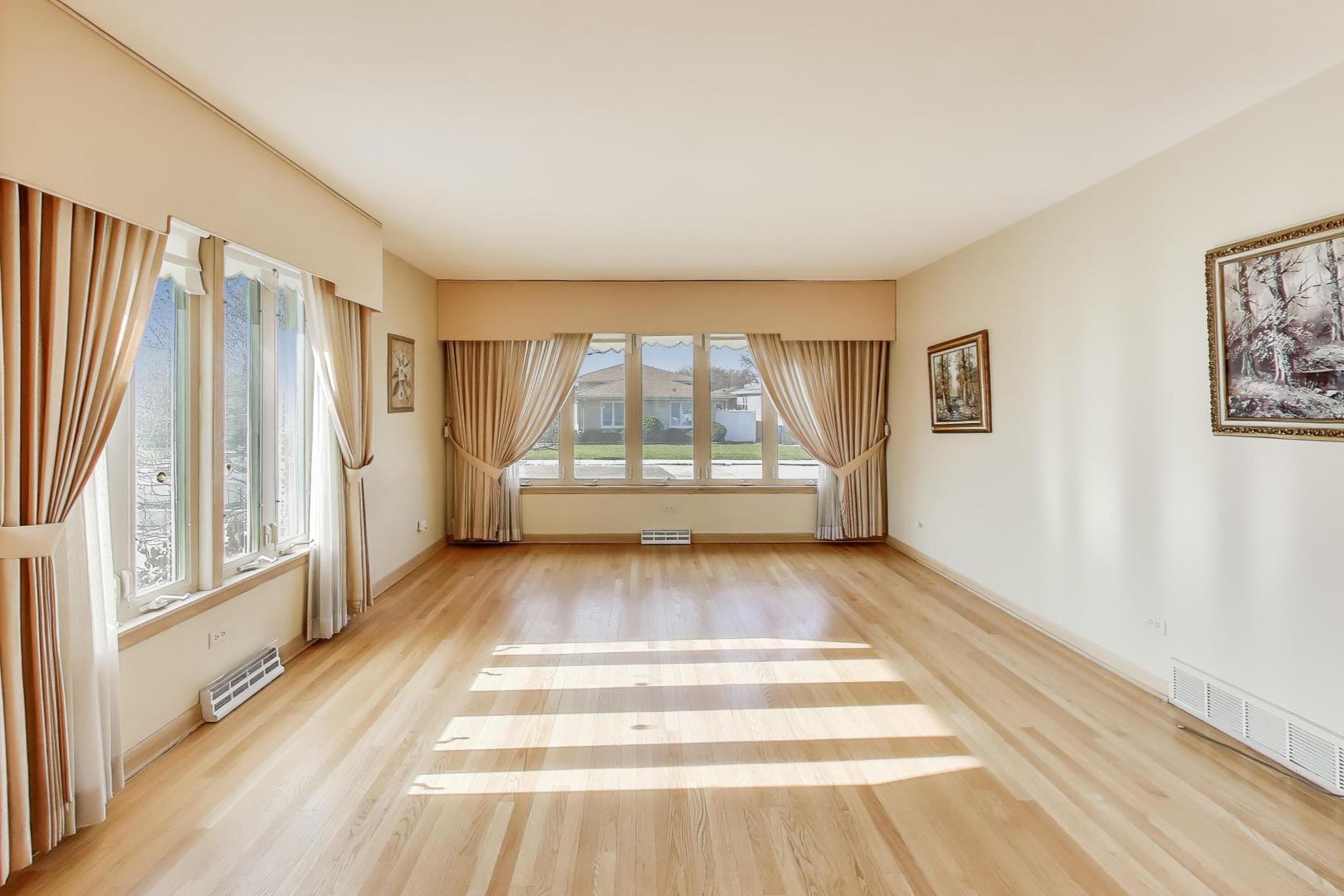 Undisclosed Address Chicago, IL 60656 - Photo 7 of 37 a view of an empty room with wooden floor and a window