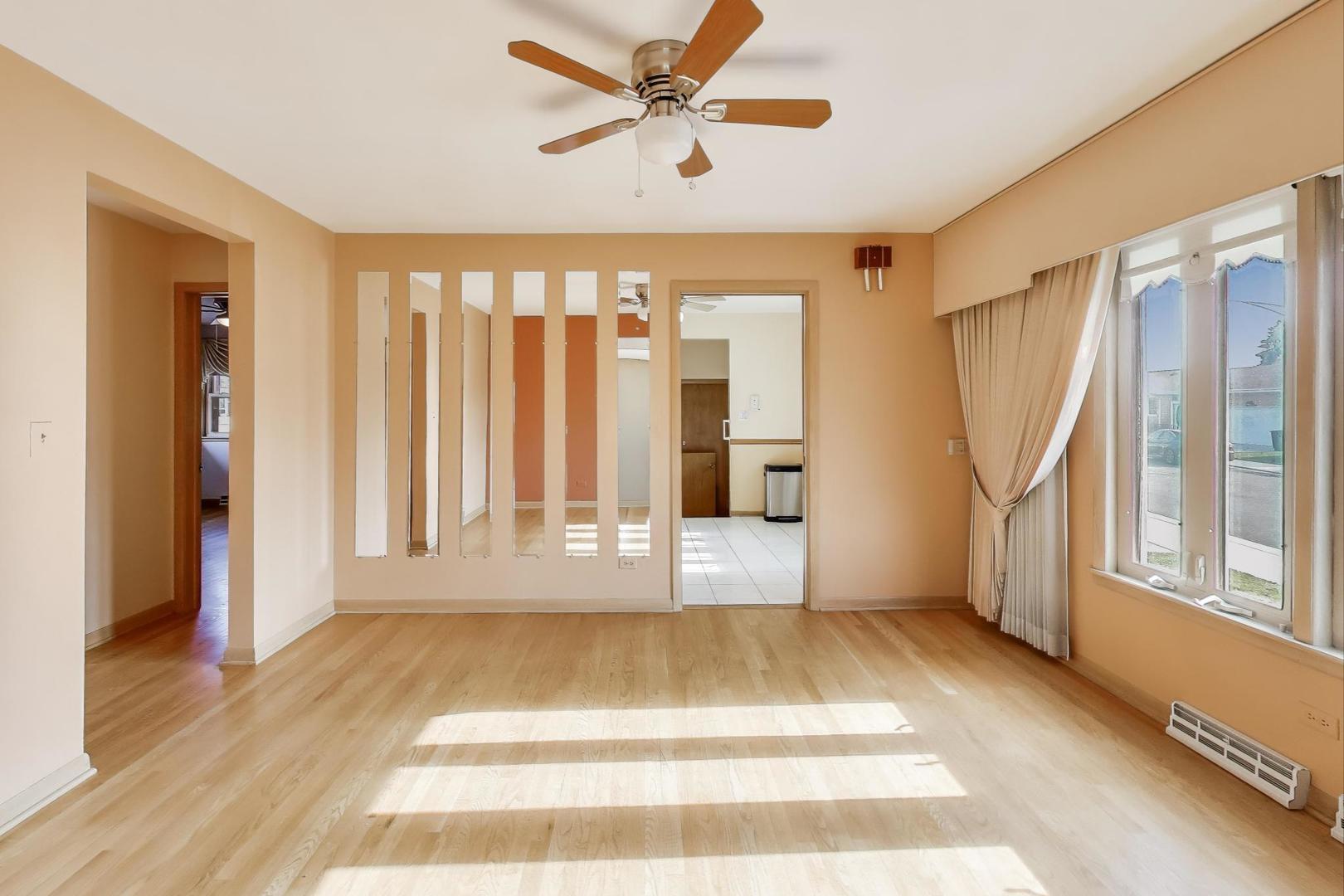 Undisclosed Address Chicago, IL 60656 - Photo 8 of 37 a view of an empty room with a window and entryway