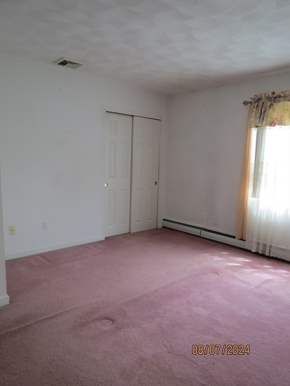 262 Acropolis Road Lowell, MA 01854 - Photo 17 of 31 a view of an empty room and a windows