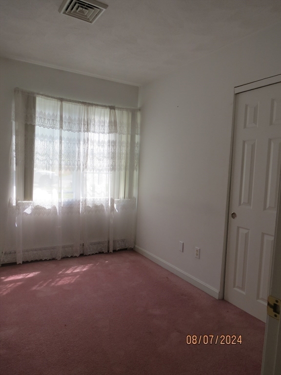 262 Acropolis Road Lowell, MA 01854 - Photo 21 of 31 an empty room with windows