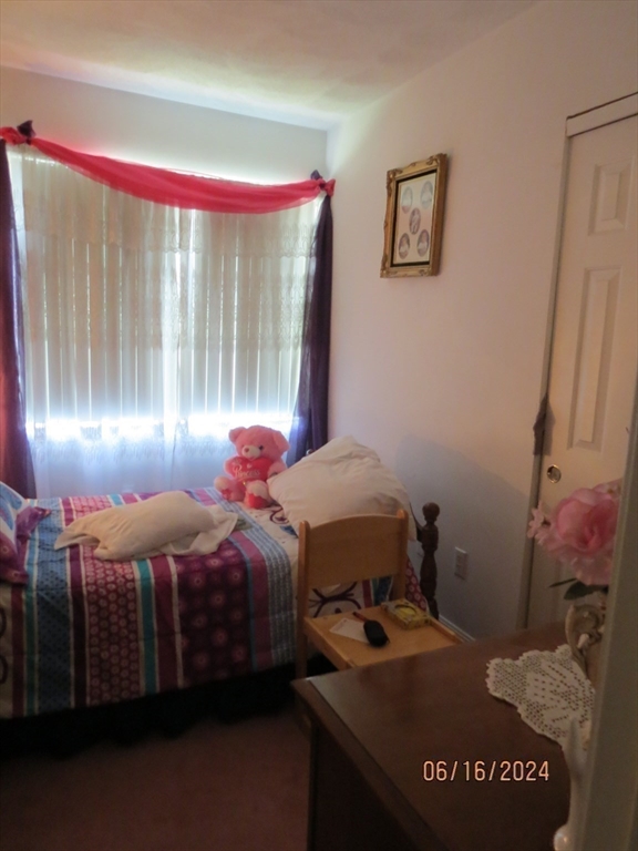 262 Acropolis Road Lowell, MA 01854 - Photo 22 of 31 a bedroom with a bed and window