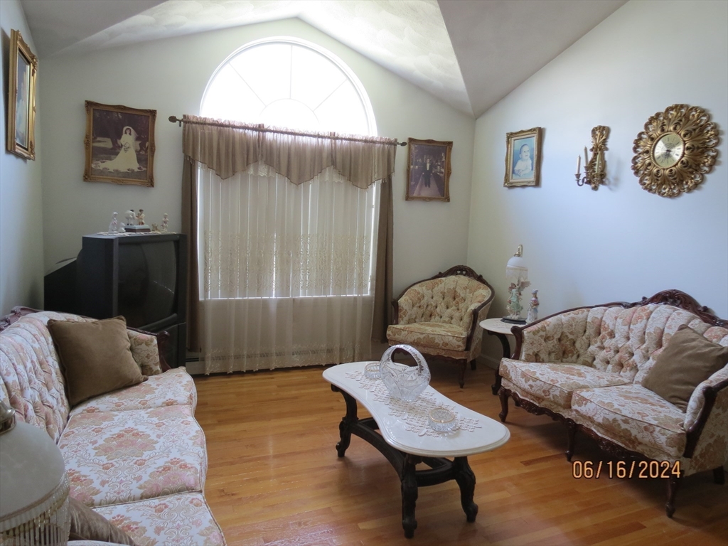 262 Acropolis Road Lowell, MA 01854 - Photo 5 of 31 a living room with furniture and a window