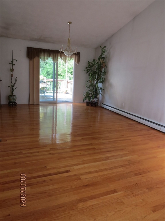 262 Acropolis Road Lowell, MA 01854 - Photo 7 of 31 view of room with window and wooden floor
