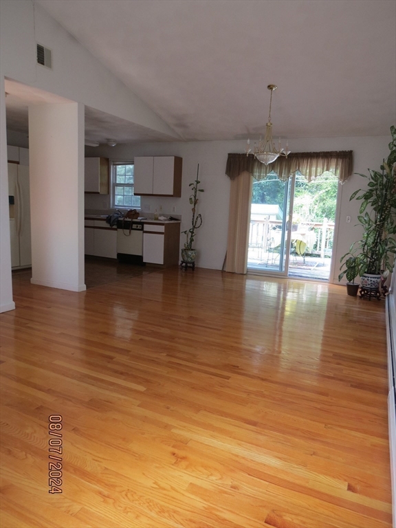 262 Acropolis Road Lowell, MA 01854 - Photo 9 of 31 a view of a living room or kitchen and hardwood floor