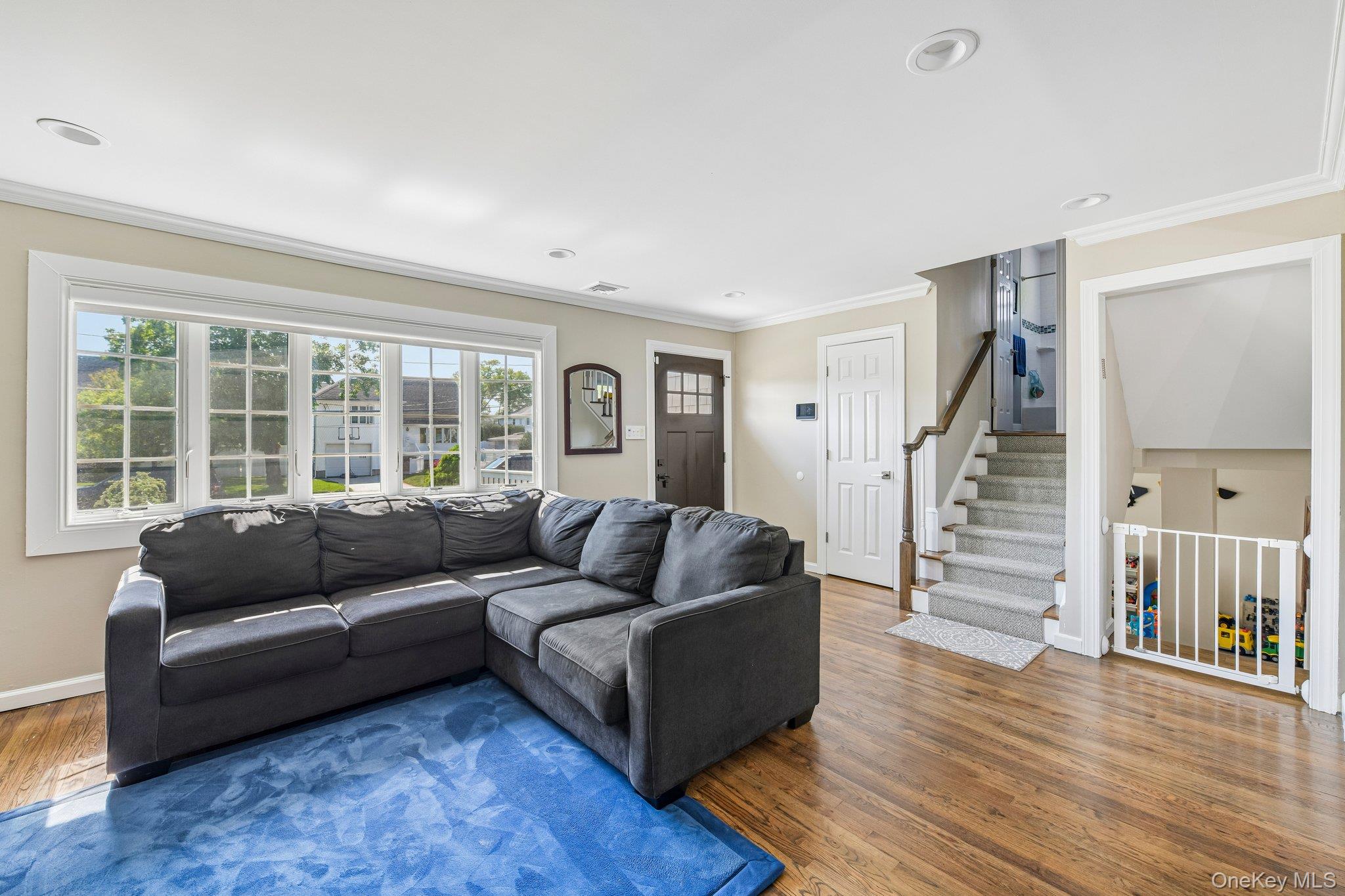 2821 Colonial Avenue Merrick, NY 11566 - Photo 5 of 29 a living room with furniture and a large window