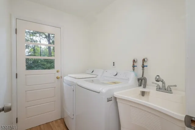 a view of bathroom with a sink and washer